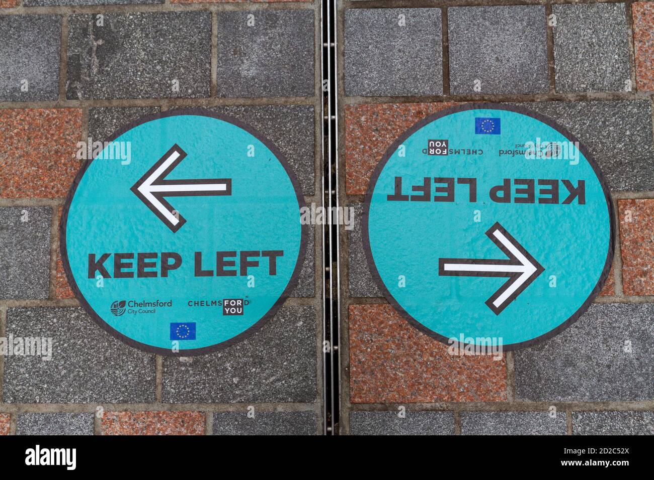 Pavement poster advising people to 'Keep Left' (to aid social distancing) during the Covid Pandemic in August 2020, Chelmsford, Essex, UK. Stock Photo
