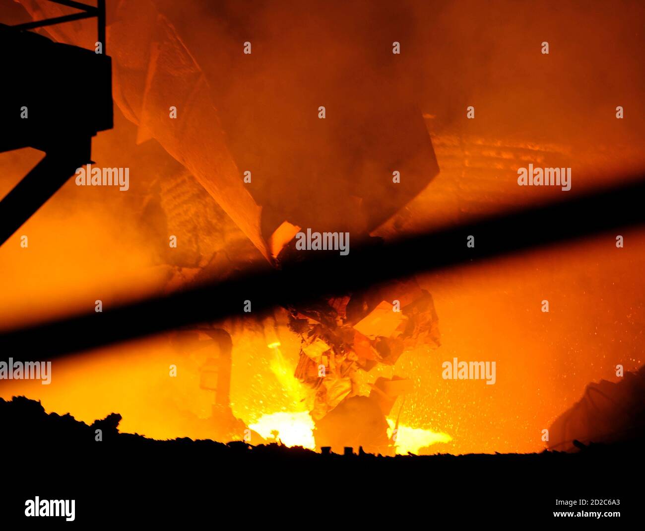 Members of the Macedonian Interior Ministry destroy drugs by burning them  at Makstil steel plant in Skopje July 8, 2008. Half a ton of cocaine,150 kg  of heroin, 260 kg of marijuana