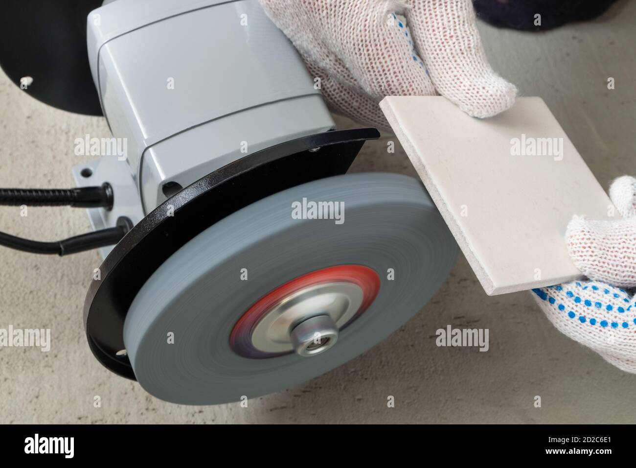Processing tile or porcelain tiles with a grinder Stock Photo Alamy