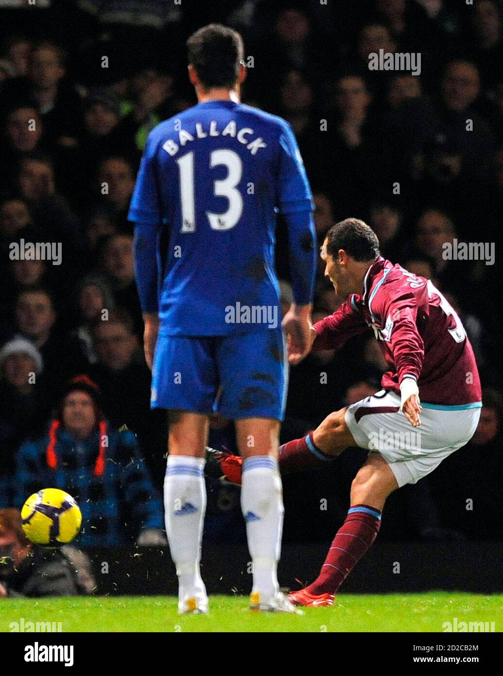 West Ham's Alessandro Diamanti (R) scores against Chelsea as Chelsea's  Michael Ballack looks on during their English Premier League soccer match  at Upton Park in London December 20, 2009. REUTERS/Toby Melville (BRITAIN -