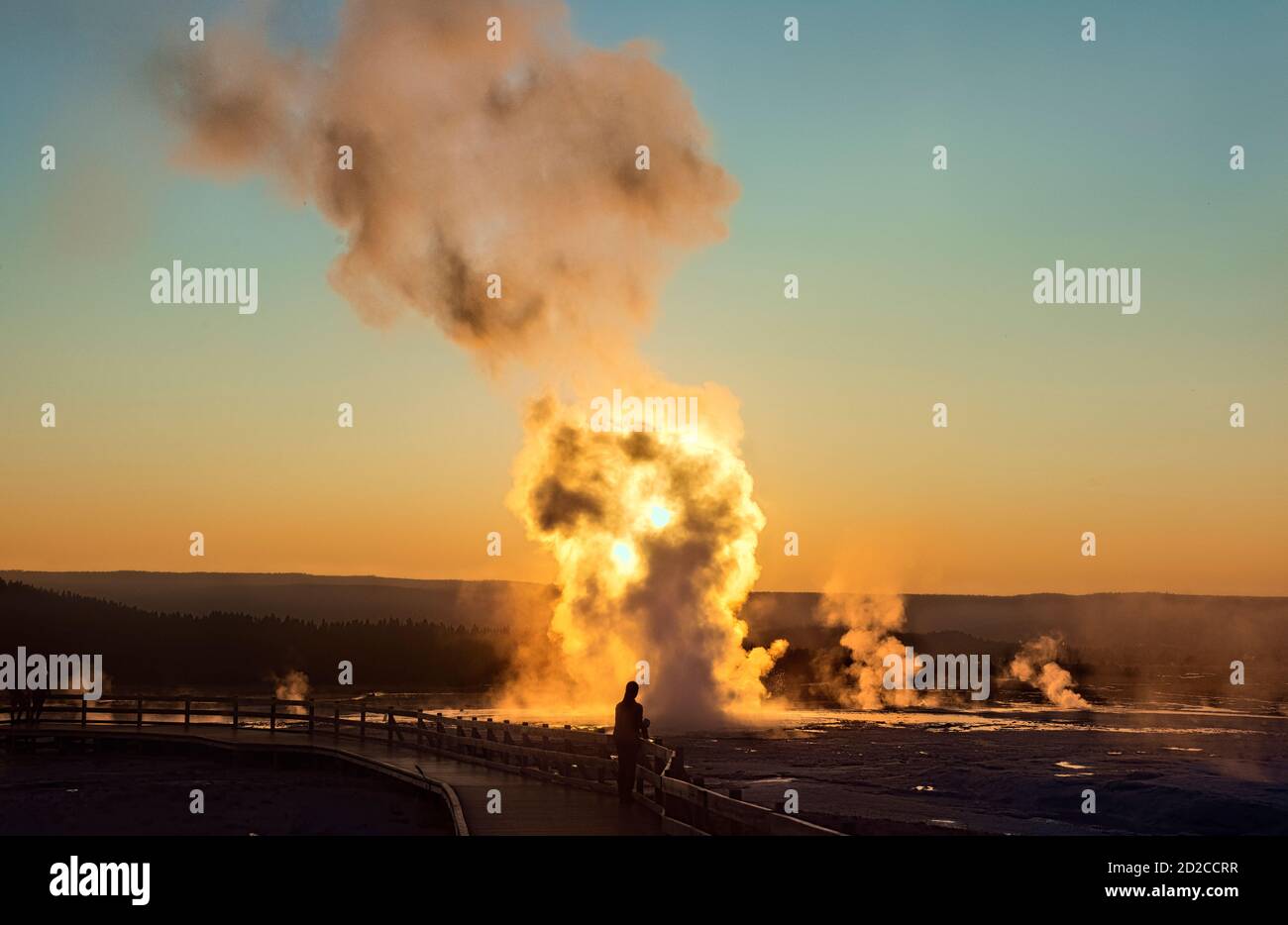 Clepsydra Geyser erupting at sunset, Lower Geyser Basin, Yellowstone National Park, Wyoming, USA Stock Photo