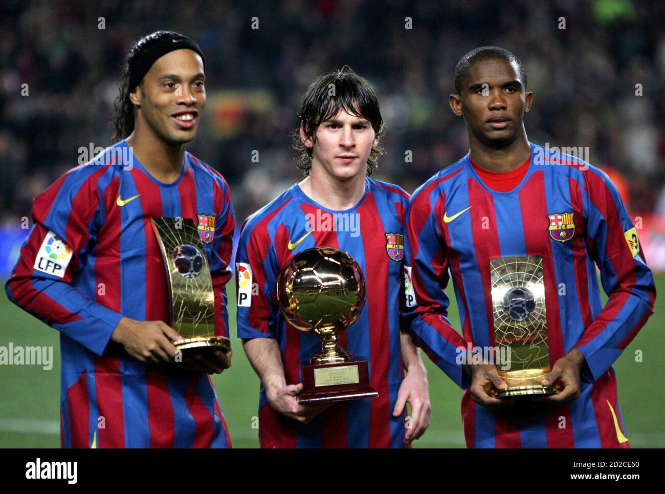 Barcelona S Brazlian Soccer Player Ronaldinho L Samuel Eto O R From Cameroon Show Their Fifa World Player Trophies And Argentinan Leo Messi C With His Golden Boy Trophy Before Their Spanish League Soccer