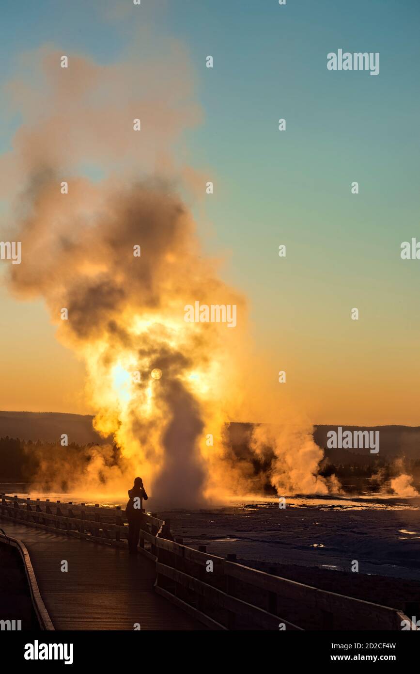 Clepsydra Geyser erupting at sunset, Lower Geyser Basin, Yellowstone National Park, Wyoming, USA Stock Photo