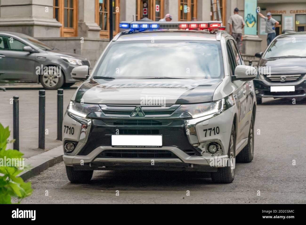Tbilisi, Georgia - June 28, 2019: police car with included beacons on an asphalt road in the city on a sunny clear day Stock Photo