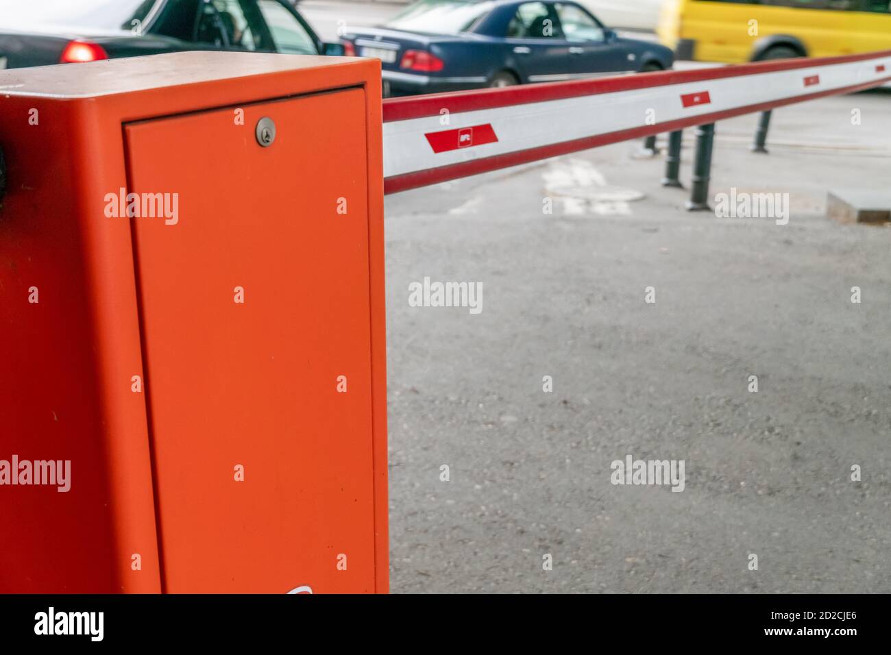automatic red-white barrier in the yard close-up during daylight hours Stock Photo