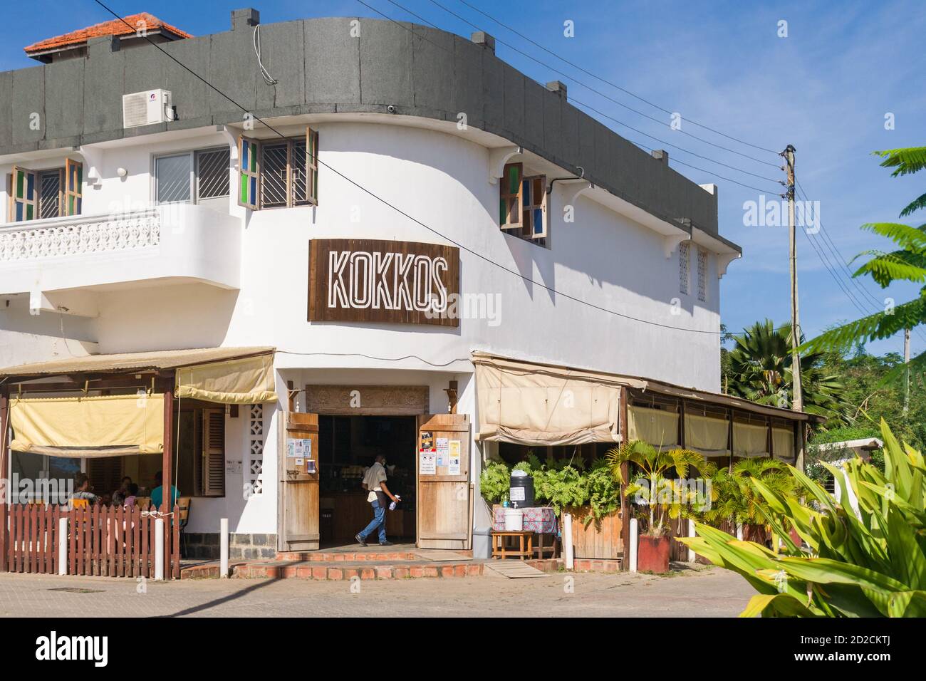Exterior of Kokkos with people seated outside, a small local coffee shop and restaurant, Diani, Kenya Stock Photo