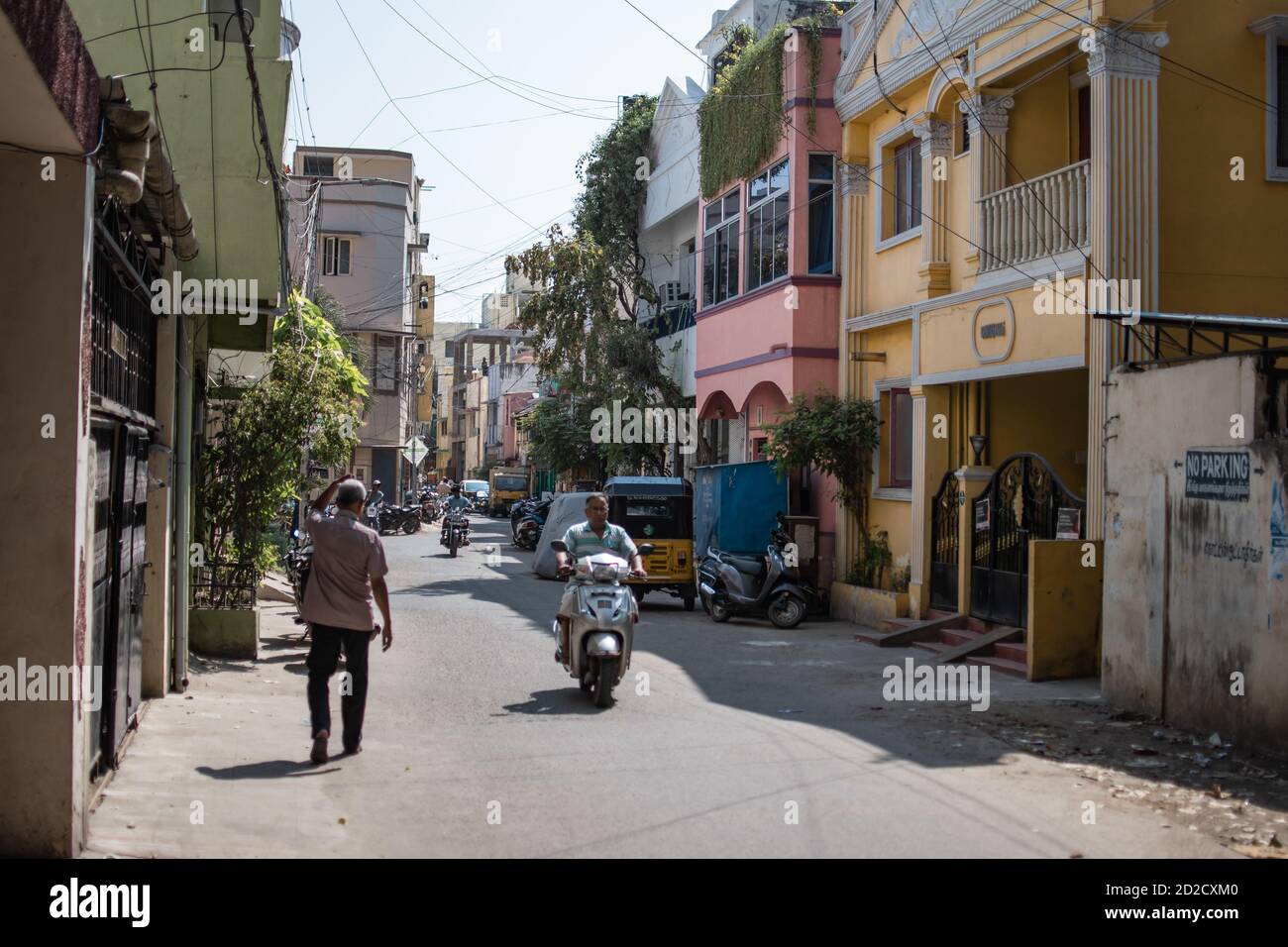 Chennai, India - February 8, 2020: Unidentified people on motorbikes, everyday  life in an alley on February 8, 2020 in Chennai, India Stock Photo