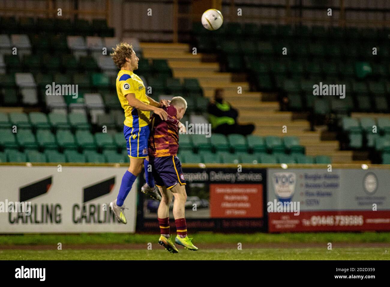 Barry, Wales, UK. 6th Oct, 2020. Chris Hugh of Barry Town wins a header  over Liam Warman of Cardiff Met Barry Town United v Cardiff Met at Jenner  Park in the JD
