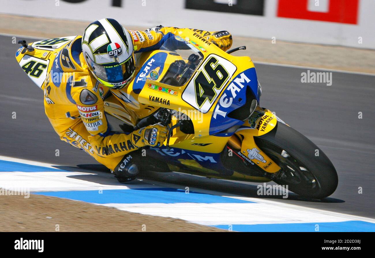 MotoGP rider Valentino Rossi of Italy takes a corner during a practice  session for the upcoming U.S. Grand Prix at the Laguna Seca racetrack near  Monterey, California, July 21, 2006. REUTERS/Lucas Jackson (