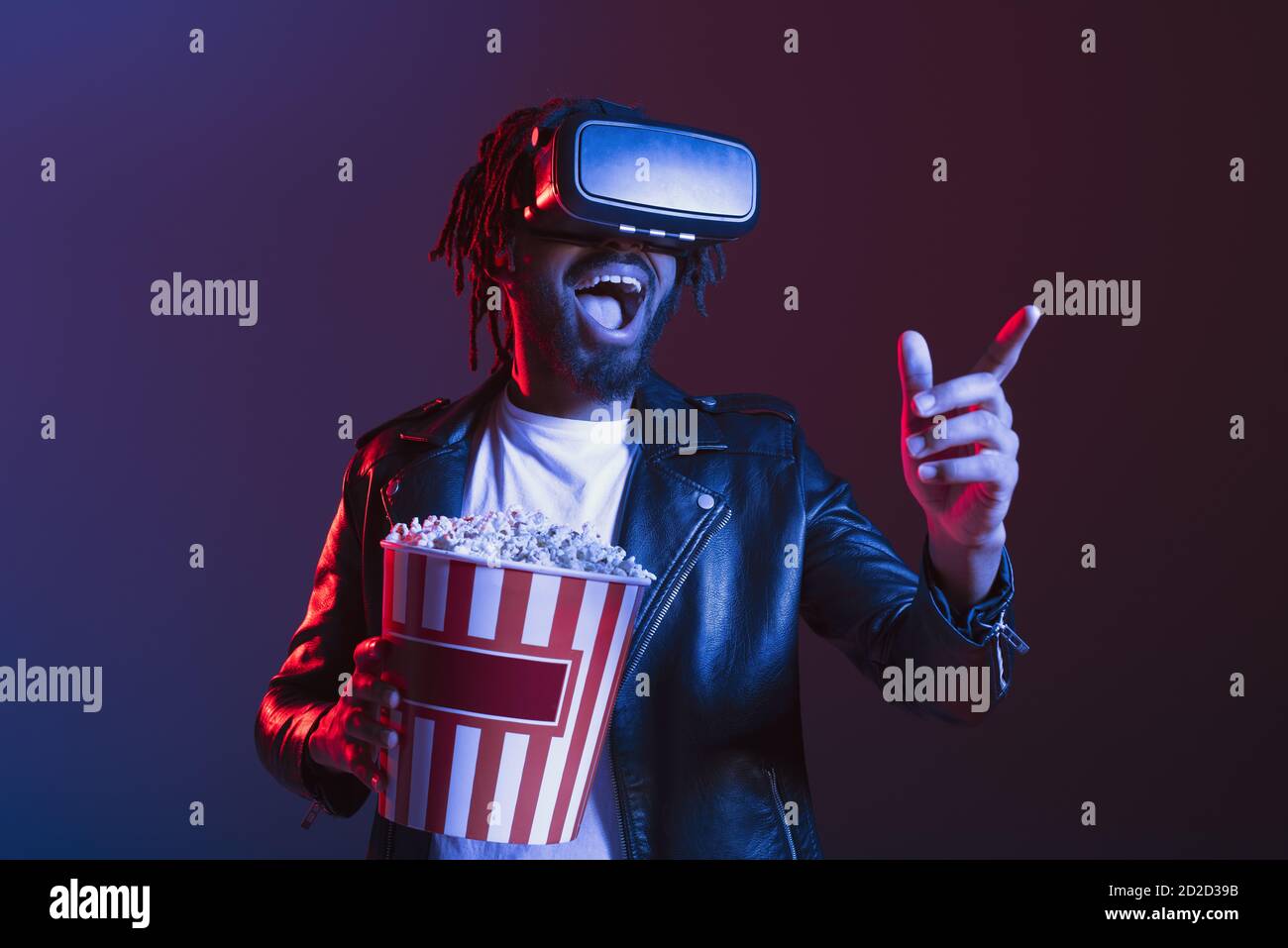 Man With Vr Glasses And Popcorn Watches A 3d Film Stock Photo Alamy