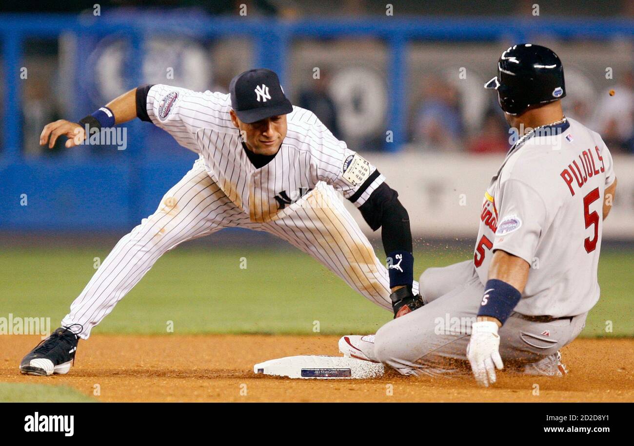 American League's Derek Jeter (L), of the New York Yankees, tags out  National League's Albert Pujols (R), of the St. Louis Cardinals, in the  fourth inning of Major League Baseball's All-Star game