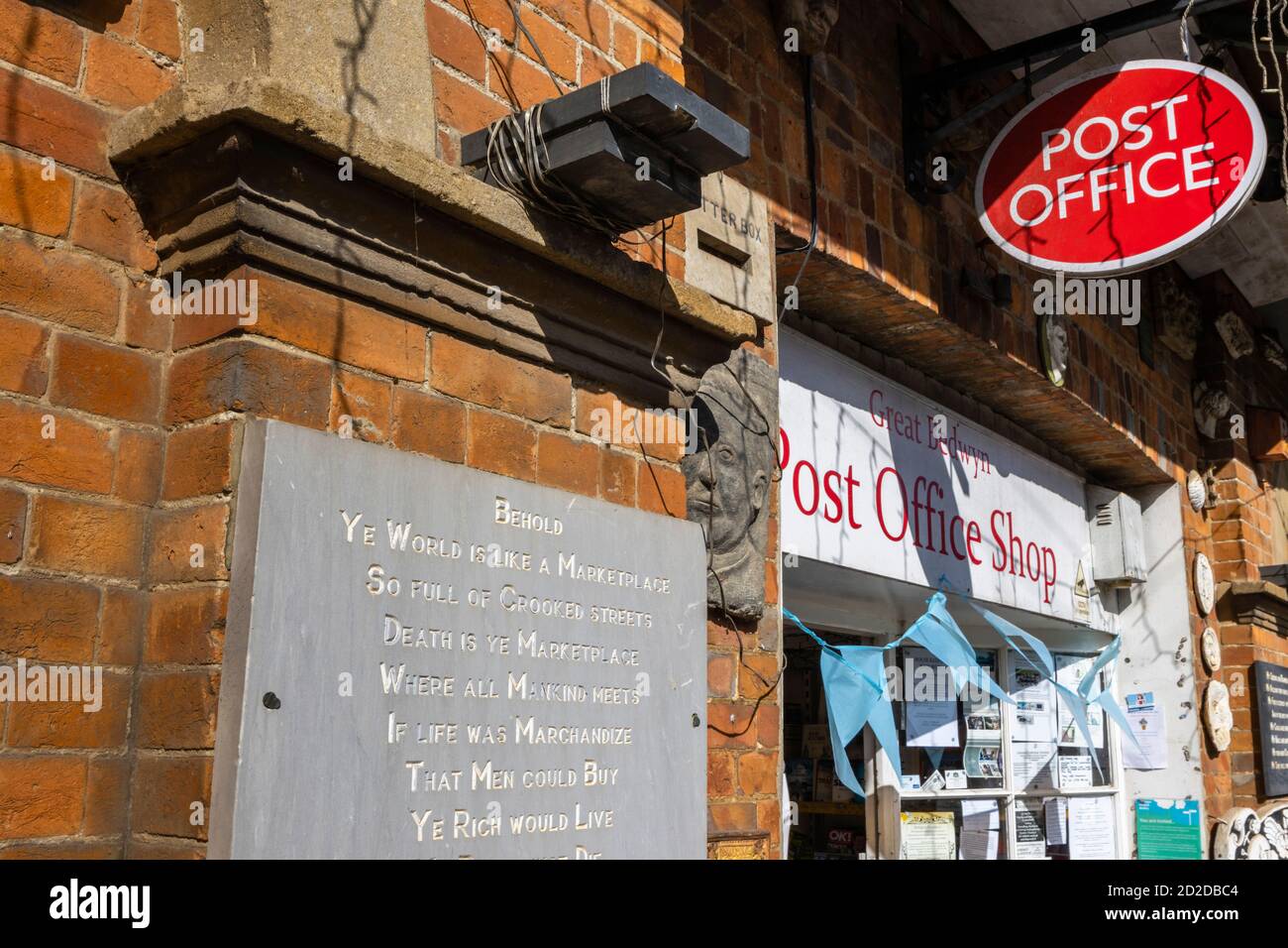 Exterior of the Post Office shop with a vintage slate inscription in