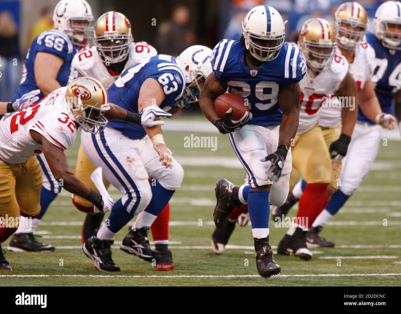 Indianapolis Colts running back Joseph Addai (29) outruns several San Francisco 49ers during their NFL football game in Indianapolis November 1, 2009. REUTERS/Brent Smith (UNITED STATES SPORT FOOTBALL) Stock Photo