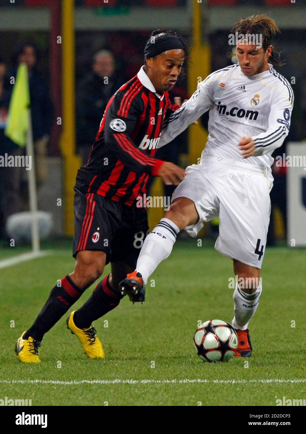 AC Milan's Ronaldinho (L) challenges Sergio Ramos of Real Madrid during  their Champions League soccer match at the San Siro stadium in Milan  November 3, 2009. REUTERS/Alessandro Bianchi (ITALY SPORT SOCCER Stock
