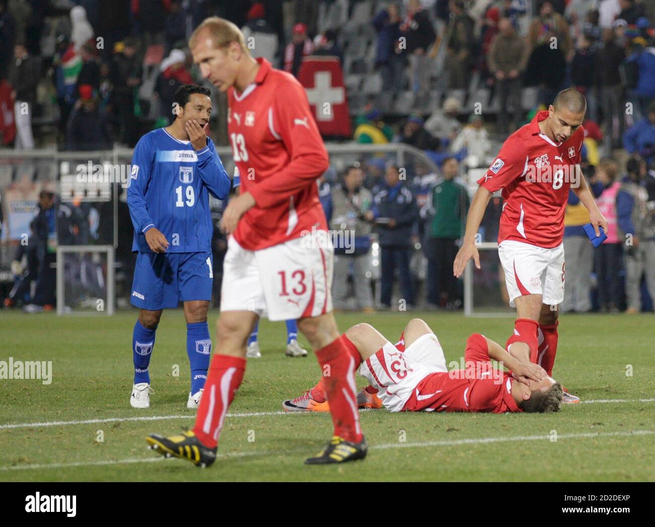 Honduras' Danilo Turcios, Switzerland's Stephane Grichting, Xherdan Shaqiri  and Gokhan Inler react after the 2010 World Cup Group H soccer match at  Free State stadium in Bloemfontein June 25, 2010. REUTERS/Siphiwe Sibeko (