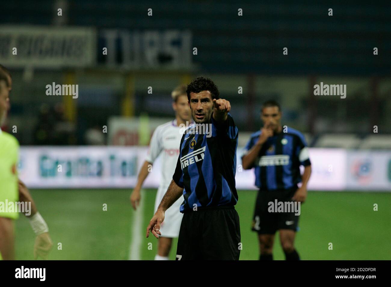 Inter Milan's Luis Figo (front L) of Portugal gestures during their Serie A soccer match against Fiorentina at the San Siro stadium in Milan, northern Italy, September 25, 2005. REUTERS/Alessandro Bianchi   BEST QUALITY AVAILABLE Stock Photo