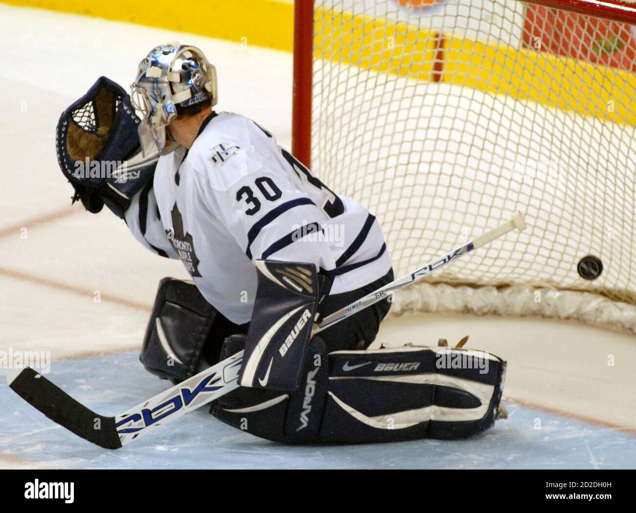 Toronto Maple Leafs goaltender Jean-Sebastien Aubin is caught off guard by  a fake as Boston Bruins Brad Boyes' over-time shoot out shot sails by him  for a 3-2 NHL win in Boston