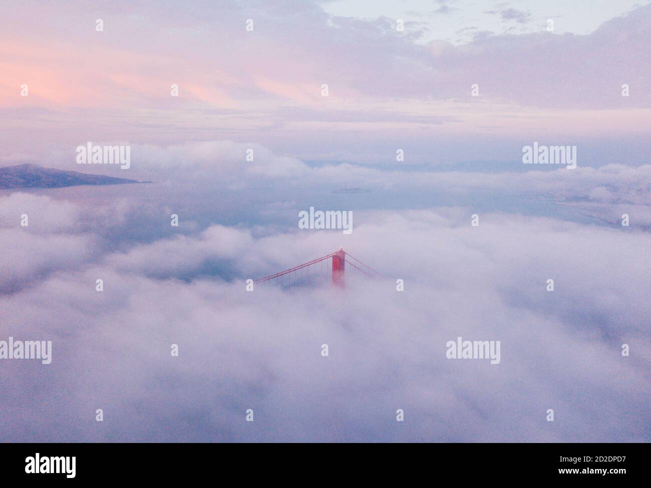 Bird's eye view of the Golden Gate Bridge under the clouds in San ...