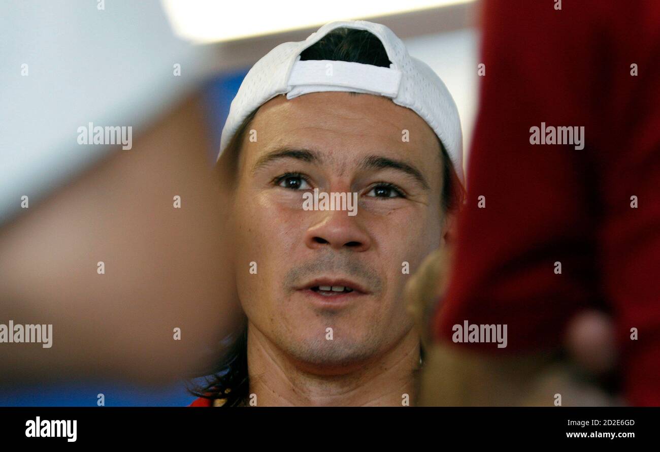 Guillermo Coria of Argentina speaks at a news conference after he retired early from a match against his compatriot Juan Pablo Brzezicki during the Copa Petrobras tennis tournament at the Pampulha Yacht Club in Belo Horizonte, central Brazil, October 23, 2007. Coria, former world number three, returned to competition after 13 months of inactivity due to shoulder problems, but retired from the match after losing the first set 3-6 and complaining of pain.  REUTERS/Washington Alves (BRAZIL) Stock Photo