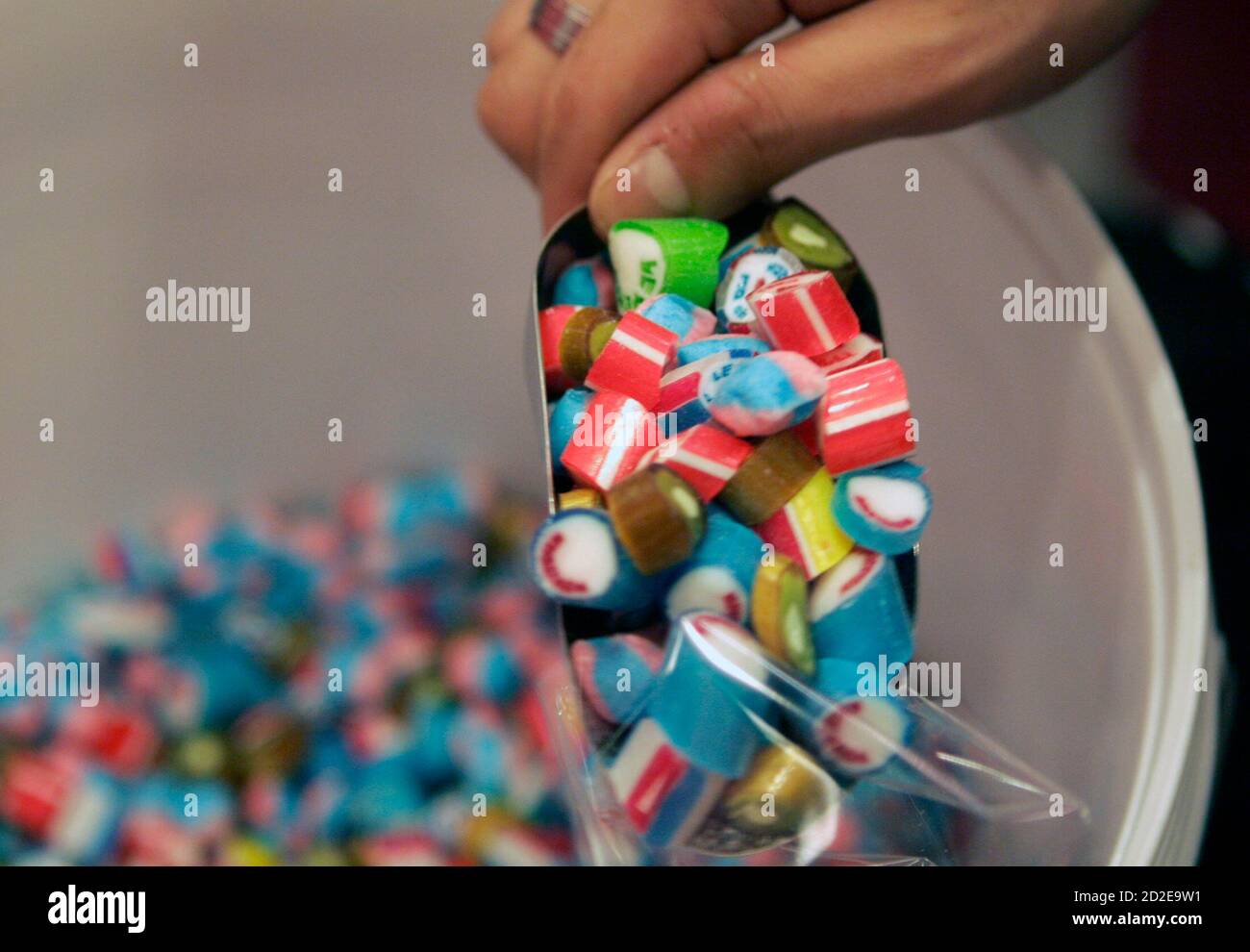 An employee packs rock candies at Sticky candy shop in Singapore