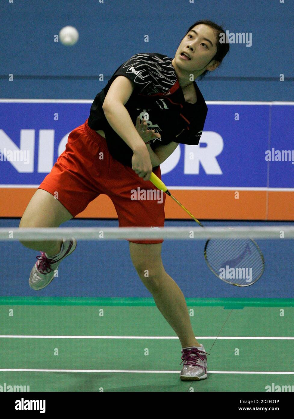 China's Wang Shixian returns a shot during her women's singles semi-final  match against South Korea's Kim Moon-hi at the Victor Korea Open Badminton  Super Series in Seoul January 16, 2010. REUTERS/Jo Yong-Hak (