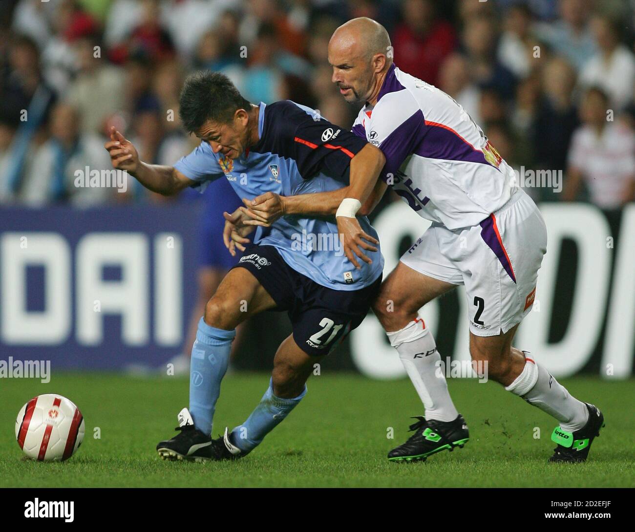 Sydney Fc S Japanese Soccer Star Kazuyoshi Kazu Miura L Is Marked By Perth Glory S Matt Horsley During An A League Game In Sydney November 19 05 Miura Will Play A Total Of Four