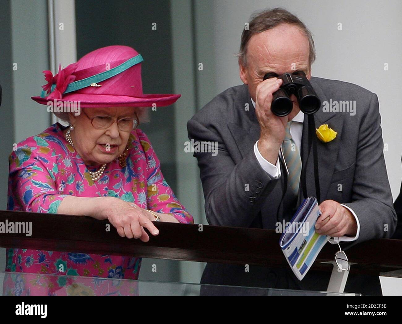 Britain's Queen Elizabeth (L) watches during the Epsom Derby Festival at Epsom Downs in Surrey, southern England, June 7, 2008.    REUTERS/Darren Staples   (BRITAIN) Stock Photo