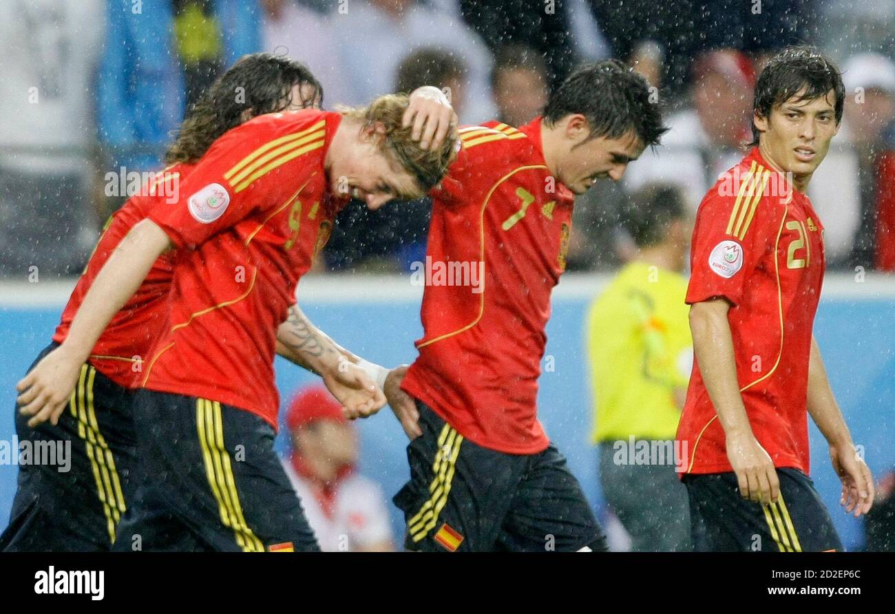 Spain's David Villa (2nd R) celebrates his goal with Fernando Torres (2ndL)  as David Silva watches during their Group D Euro 2008 soccer match against  Russia at the Ti voli Neu Stadium