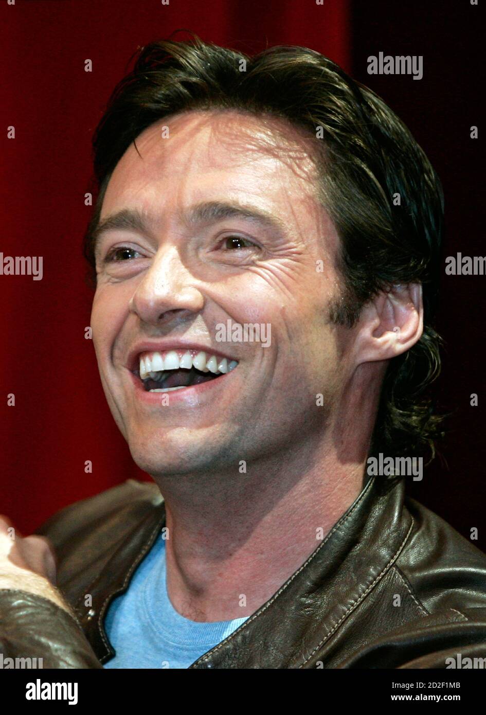 Australian Hugh Jackman, star of the Broadway hit musical "The Boy from  Oz", reacts during a news conference in Sydney February 13, 2006. Jackman  joined part of the cast and producers to