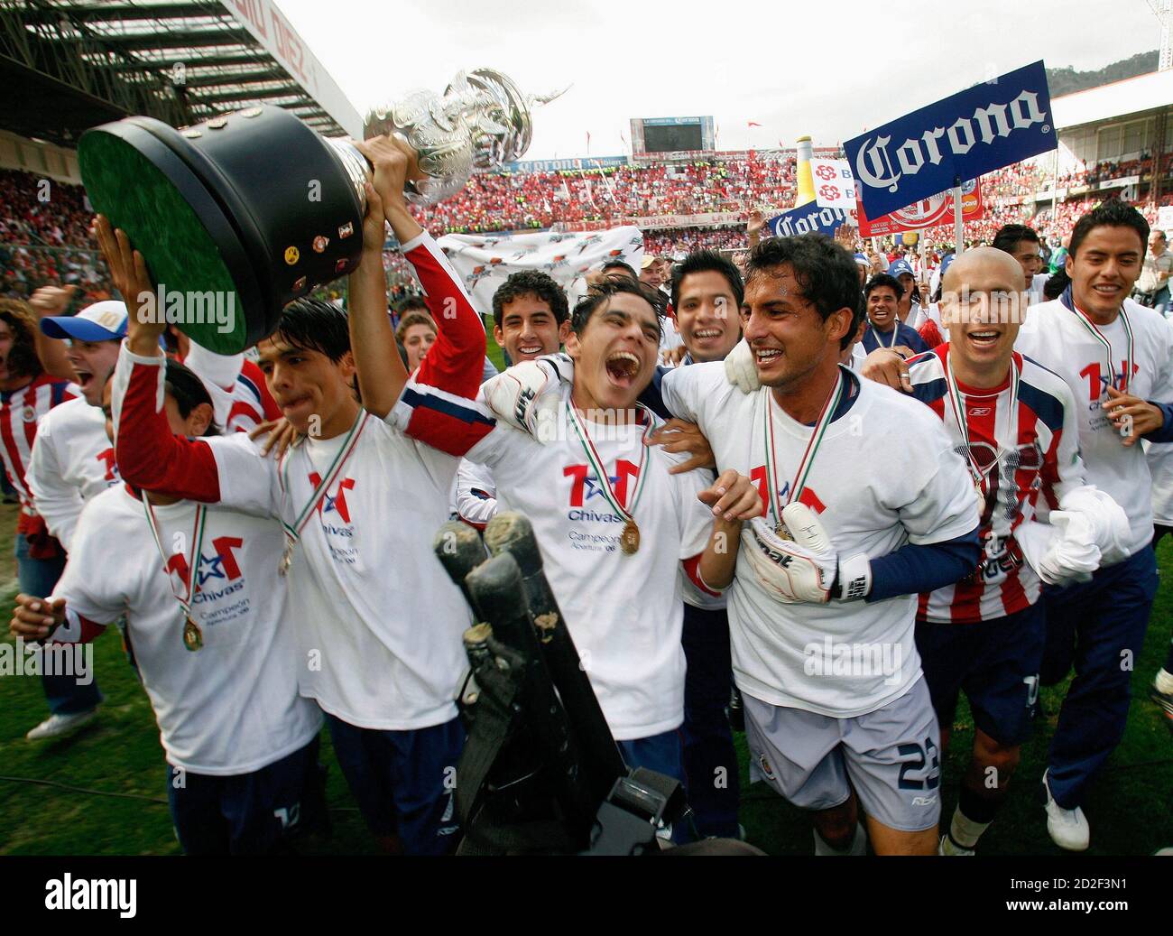Chivas Midfielder Gonzalo Pineda 2nd L Holds Up The Trophy As Team Mates Celebrate After Winning The Mexican League Championship Final Soccer Match Against Toluca At The Nemesio Diez Stadium In Toluca