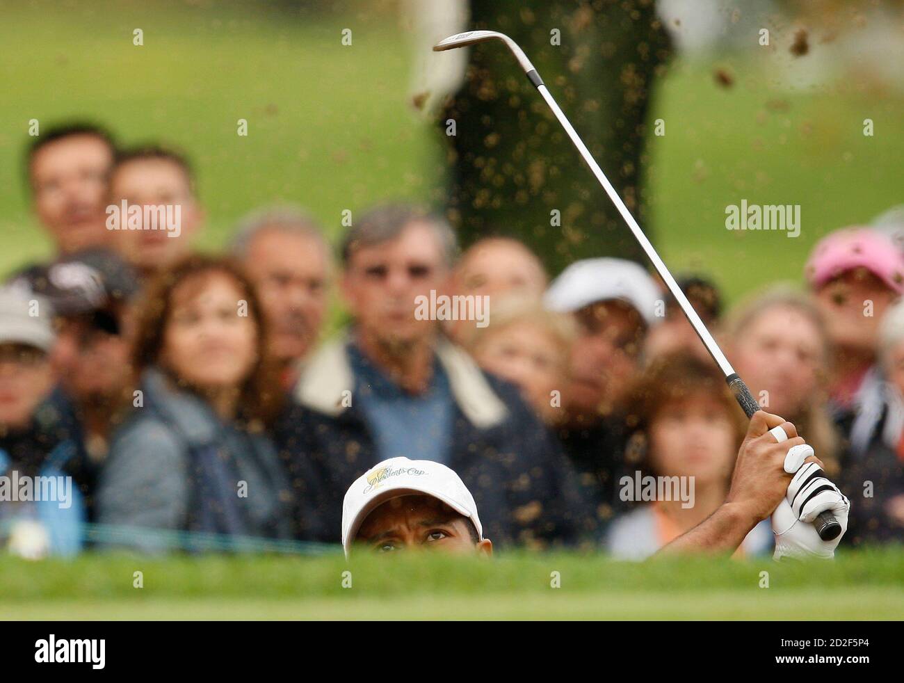 Tiger Woods of the U.S. team hits from a bunker on the third hole while playing with Charles Howell III during their first round foursome match at the President's Cup golf tournament at the Royal Montreal Golf Club, September 27, 2007.     REUTERS/Shaun Best (CANADA) Stock Photo