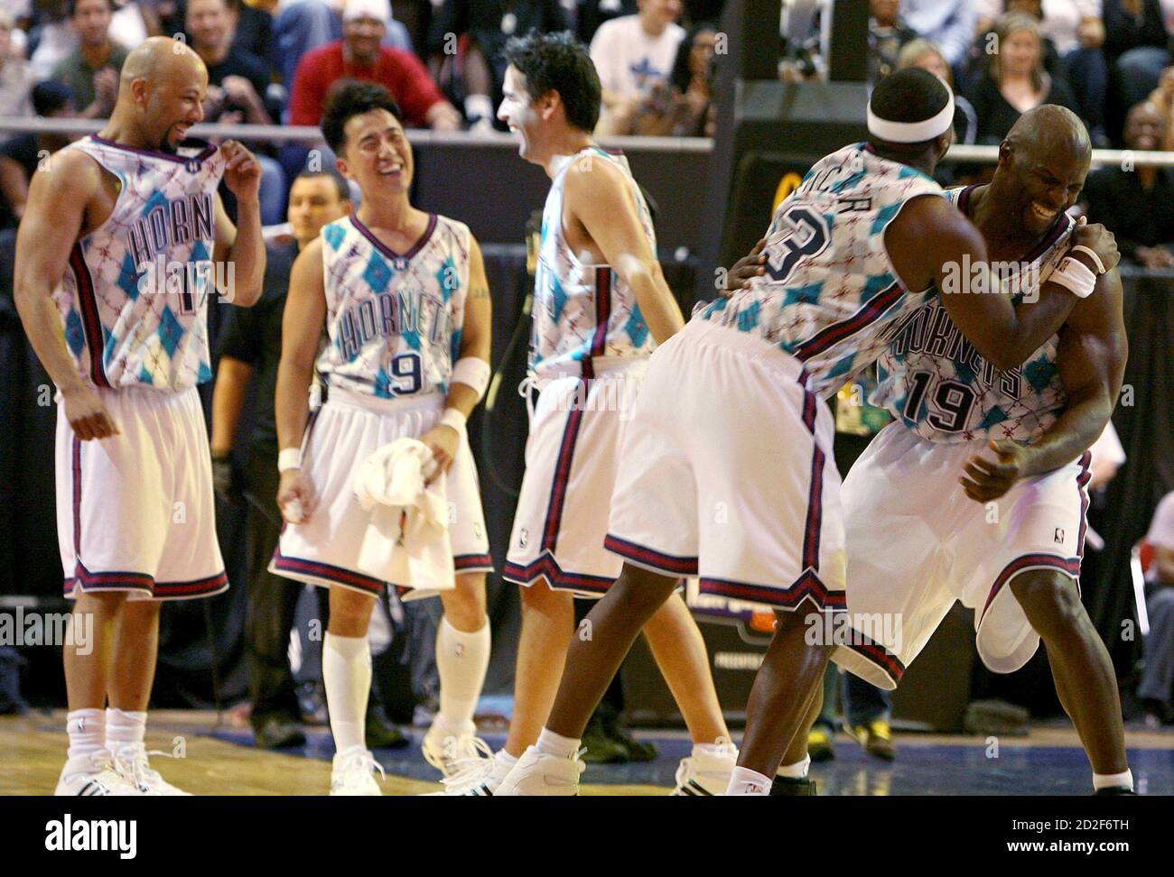 Actors Terry Crews (R) and Chris Tucker (L) laugh with one another while  playing in the McDonald's NBA All-Star Celebrity Game at the Morial  Convention Center in New Orleans, Louisiana February 15,