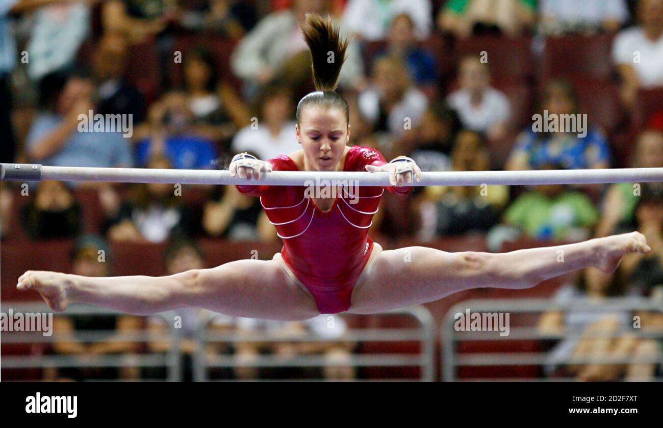 Gymnast Chellsie Memmel reaches for the bar during the uneven parallel bar  event at the 2008 U.S. Olympic gymnastics team trials in Philadelphia,  Pennsylvania, June 20, 2008. REUTERS/Tim Shaffer (UNITED STATES)(BEIJING  OLYMPICS