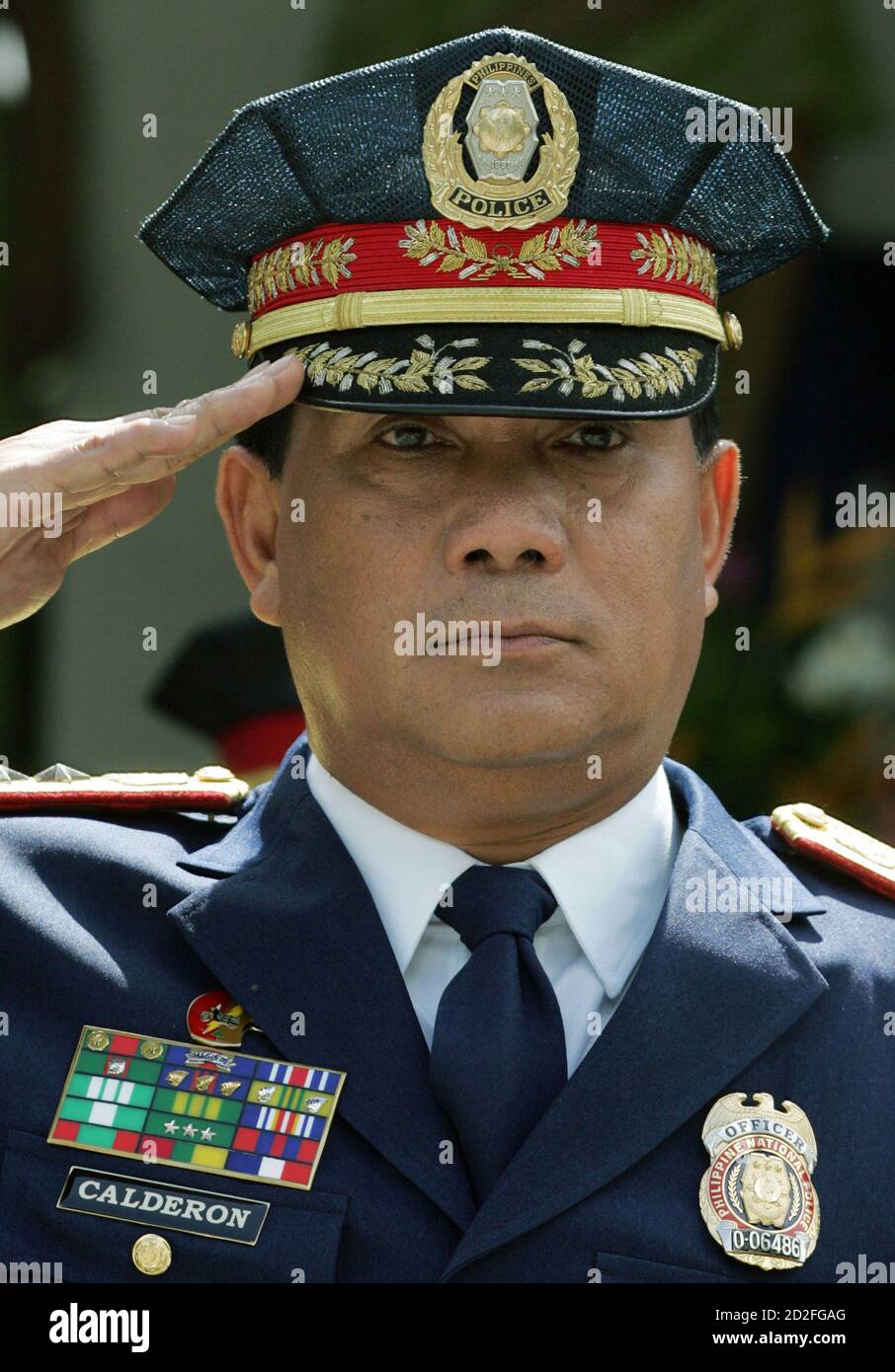 Incoming Philippine National Police Chief General Oscar Calderon salutes at  a handover ceremony at the police headquarters in Manila July 5, 2006 Stock  Photo - Alamy