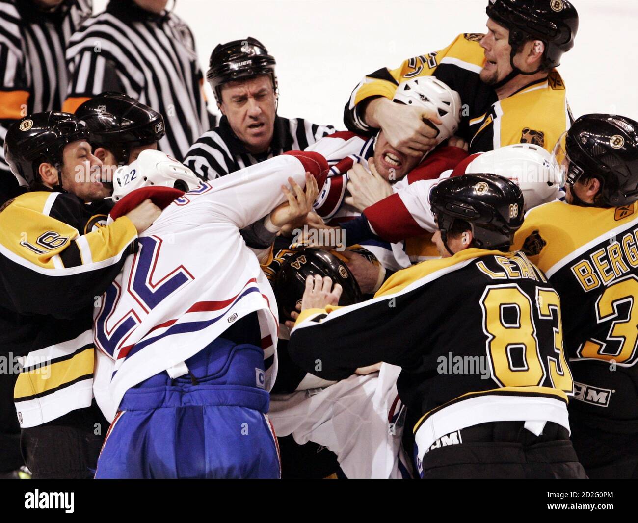 (L-R) Boston Bruins Marco Sturm (16), Montreal Canadiens Steve Begin (22), Nick Boynton (44 obscured), Canadiens Craig Rivet (face covered), Bruins Patrick Leahy (83), Bruins Hal Gill (25 grabbing Rivet's face) and Bruins Patrice Bergeron fight in the second period of their NHL game in Boston, Massachusetts March 9, 2006.      REUTERS/Brian Snyder Stock Photo