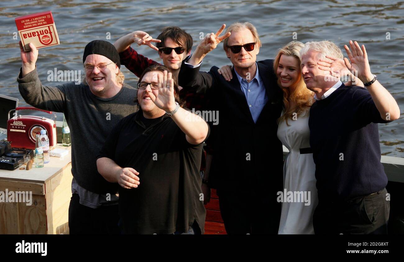 Actors Philip Seymour Hoffman, Nick Frost, Tom Sturridge, Bill Nighy,  Talulah Riley and director Richard Curtis pose for media on a boat to  promote their new movie "Radio Rock Revolution" in Berlin