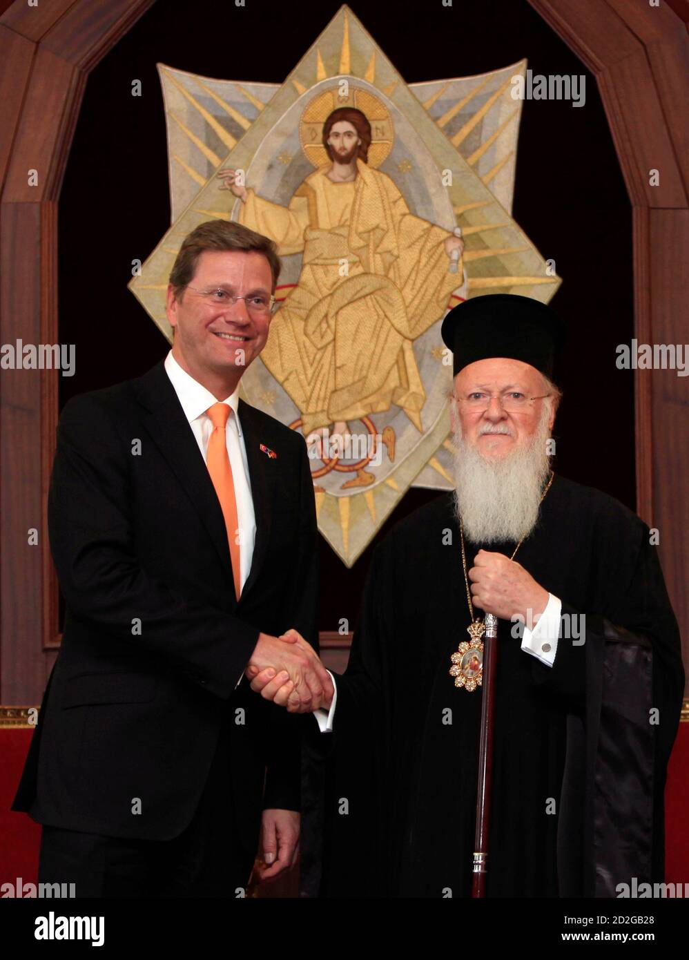 Germany's Foreign Minister Guido Westerwelle (L), leader of Germany's liberal party, the Free Democratic Party (FDP), shakes hands with Ecumenical Orthodox Patriarch Bartholomew I at the Greek Orthodox Patriarchate in Istanbul January 8, 2010. REUTERS/Murad Sezer (TURKEY - Tags: POLITICS RELIGION SOCIETY) Stock Photo