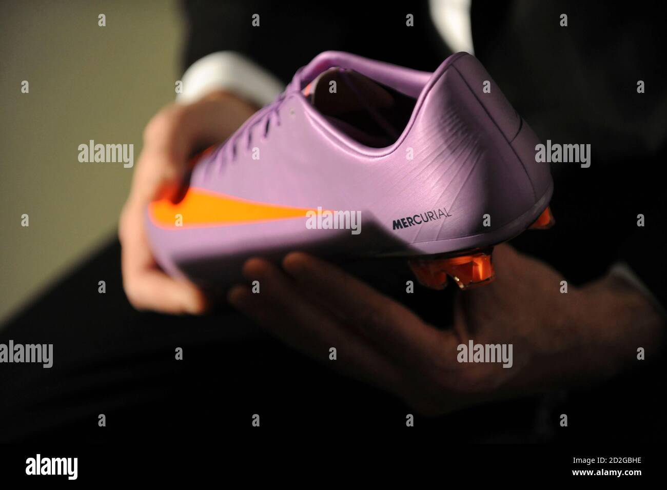 Nike CEO Mark Parker holds the new Mercurial Vapor SuperFly II soccer boot  during its launch at an event in London February 24, 2010. REUTERS/Jas  Lehal (BRITAIN - Tags: SPORT SOCCER BUSINESS