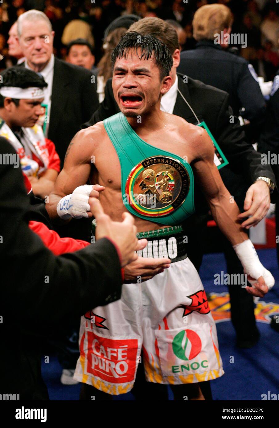 Super featherweight boxer Manny Pacquiao of Cebu City, Philippines, celebrates his victory over Erik Morales of Tijuana, Mexico, at the Thomas & Mack Center in Las Vegas January 21, 2006. Pacquiao won the fight with a 10th round TKO. REUTERS/Steve Marcus Stock Photo