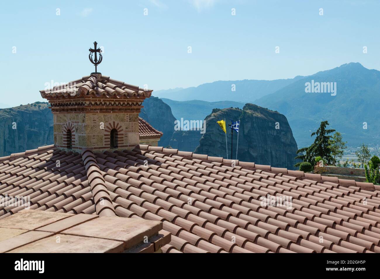 Tiles and cross on roof of the Holy Monasteries of Meteora, Trikala, Greece. Stock Photo