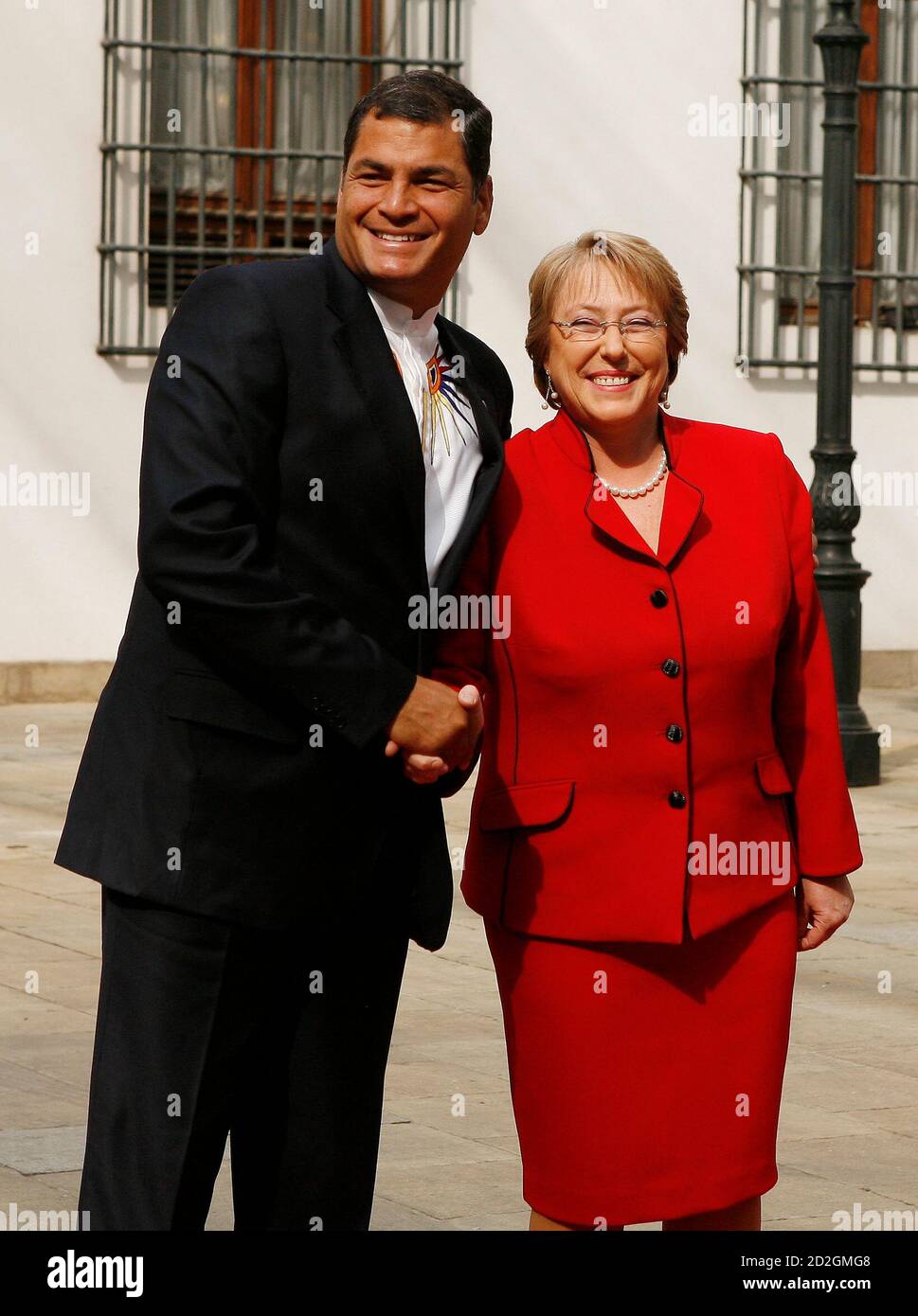 Ecuador's President Rafael Correa shakes hands Chile's President Michelle  Bachelet during a meeting in Santiago September 15, 2008. Bolivian  President Evo Morales arrived in Chile on Monday for an emergency summit  with