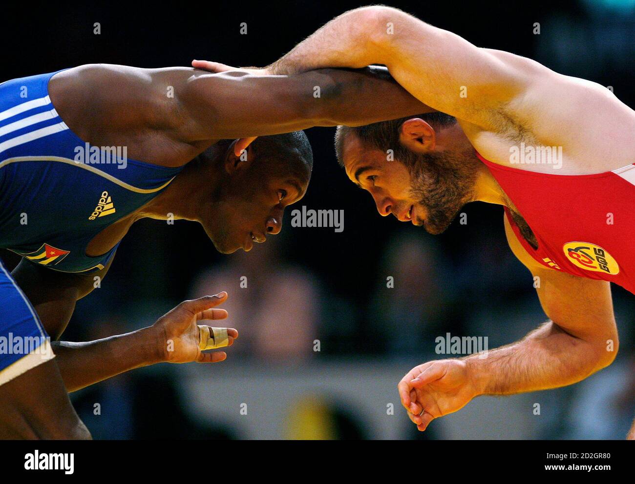 Geandri Garzon of Cuba (L) challenges Albert Batyrov of Bulgaria in the  men's 66 kg free-style qualification round during the World Wrestling  Championships 2009 in Herning September 21, 2009. REUTERS/Bob Strong  (DENMARK