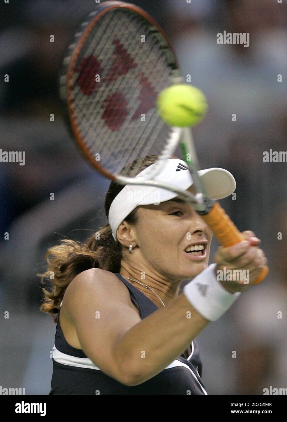 Martina Hingis of Switzerland hits a forehand against Emma Laine of