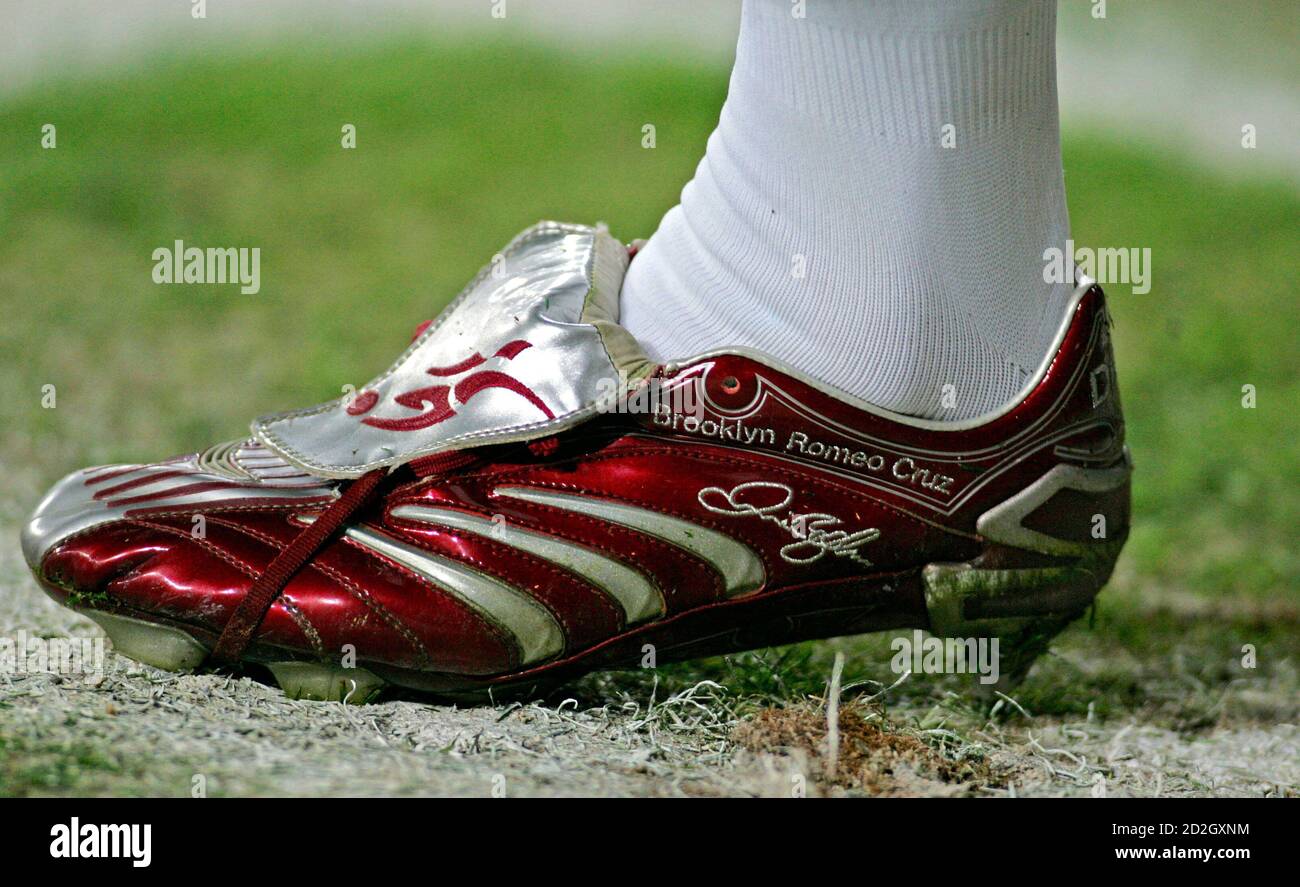 Real Madrid's David Beckham's custom-made Adidas Predator boots showing the  names of their sons Brooklyn, Romeo and Cruz, are seen as he gets ready to  kick the ball during his team's King's