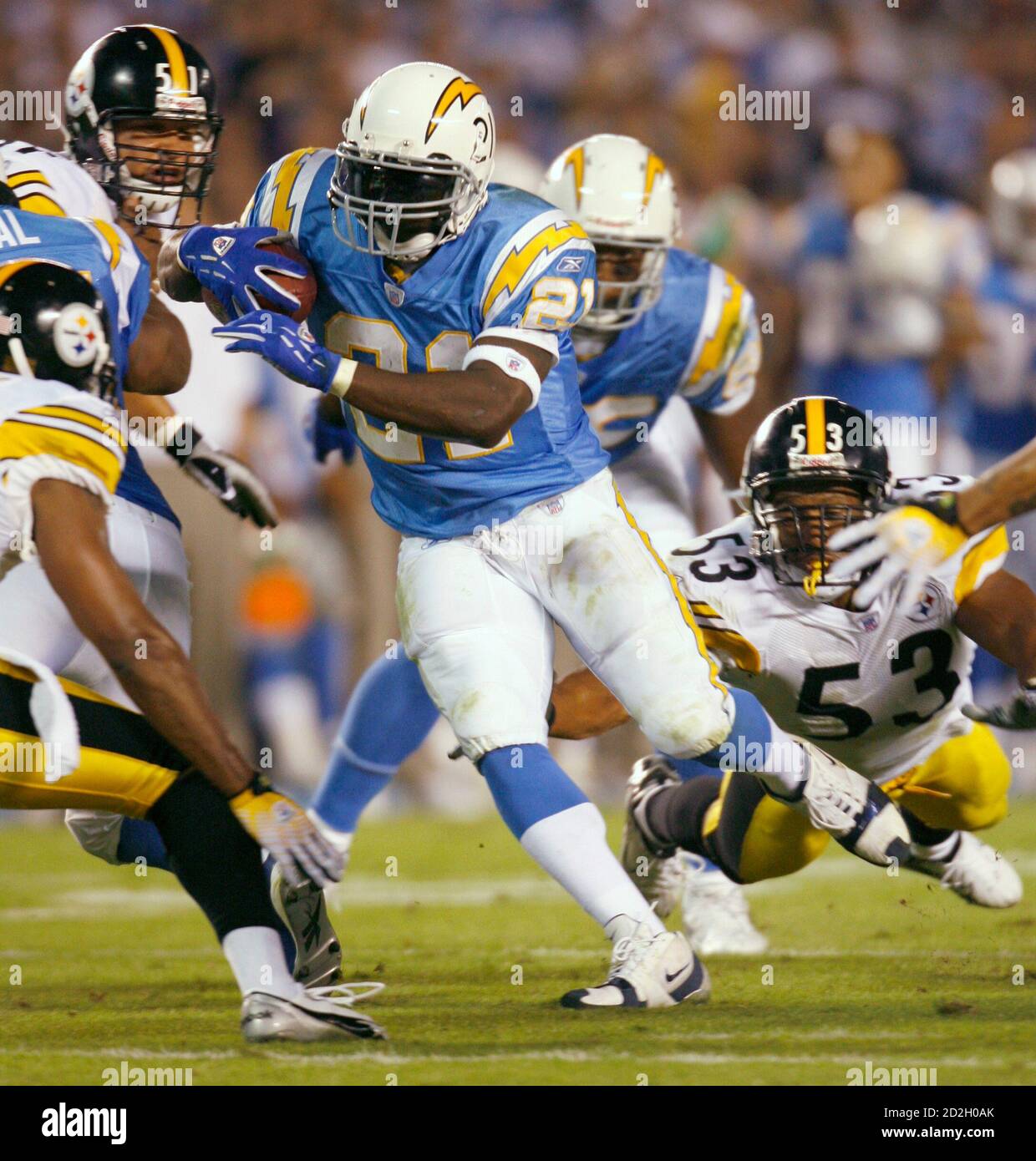 San Diego Chargers running back LaDainian Tomlinson (C) runs against the Pittsburgh Steelers during their National Football League game in San Diego, California, October 8, 2006.  REUTERS/Mike Blake(UNITED STATES) Stock Photo