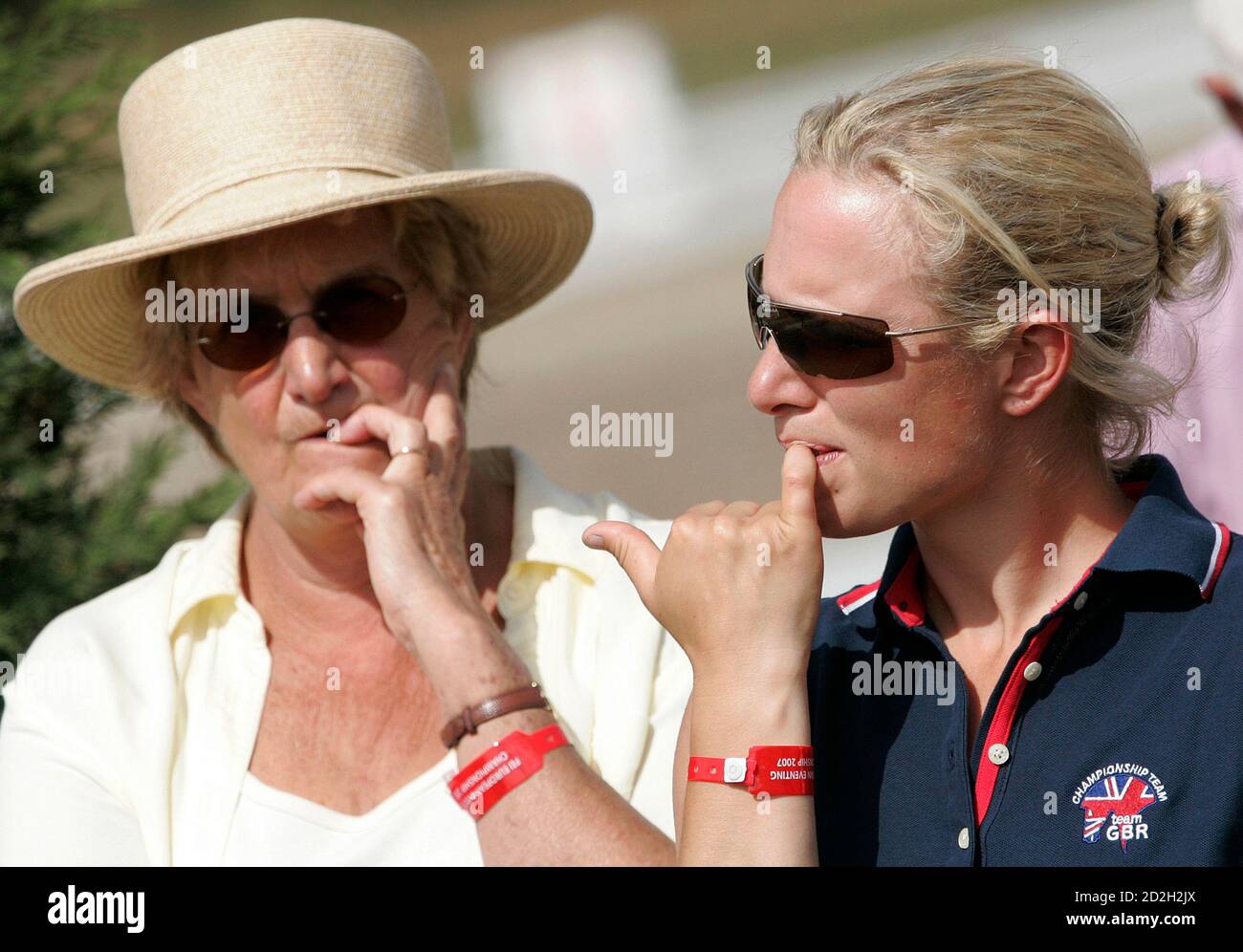 Britain's Zara Phillips (R), granddaughter of Queen Elizabeth II, watches  team mate Rodney Powell compete during the European Equestrian Championship  at the Pratoni Del Vivaro in southern Rome September 14, 2007.  REUTERS/Alessandro