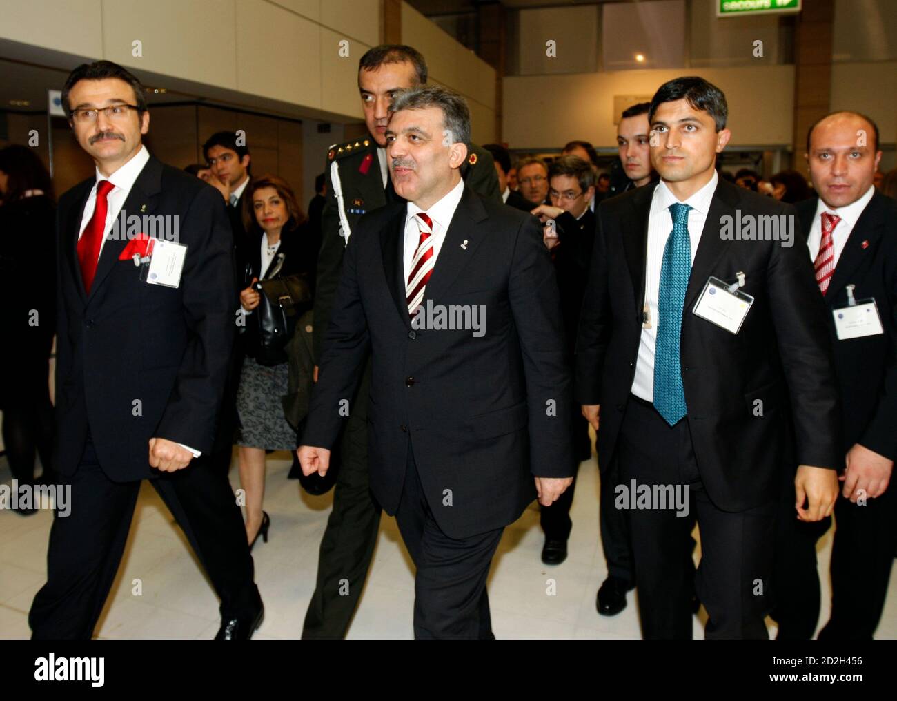 Turkey's President Abdullah Gul (C) leaves after the International  Exhibitions Bureau members (BIE) announced in Paris that the city of Milan  will host the 2015 World Expo after a secret vote on