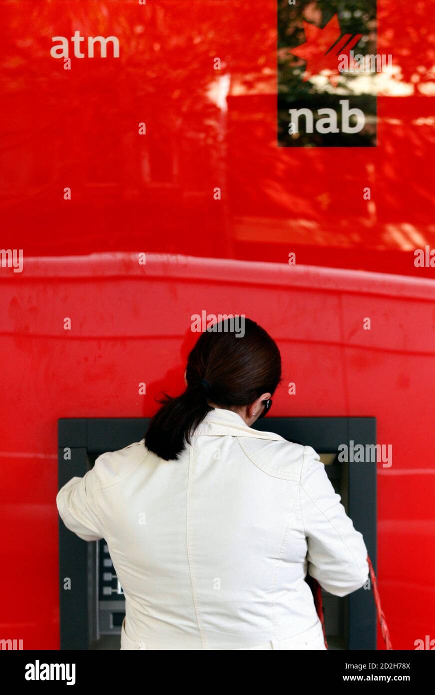 A Customer Uses An Automatic Teller Machine At A National Australia Bank Branch In Melbourne April 28 2009 Shares In National Australia Bank Nab The Nation S Top Lender Fell 3 5 Percent On