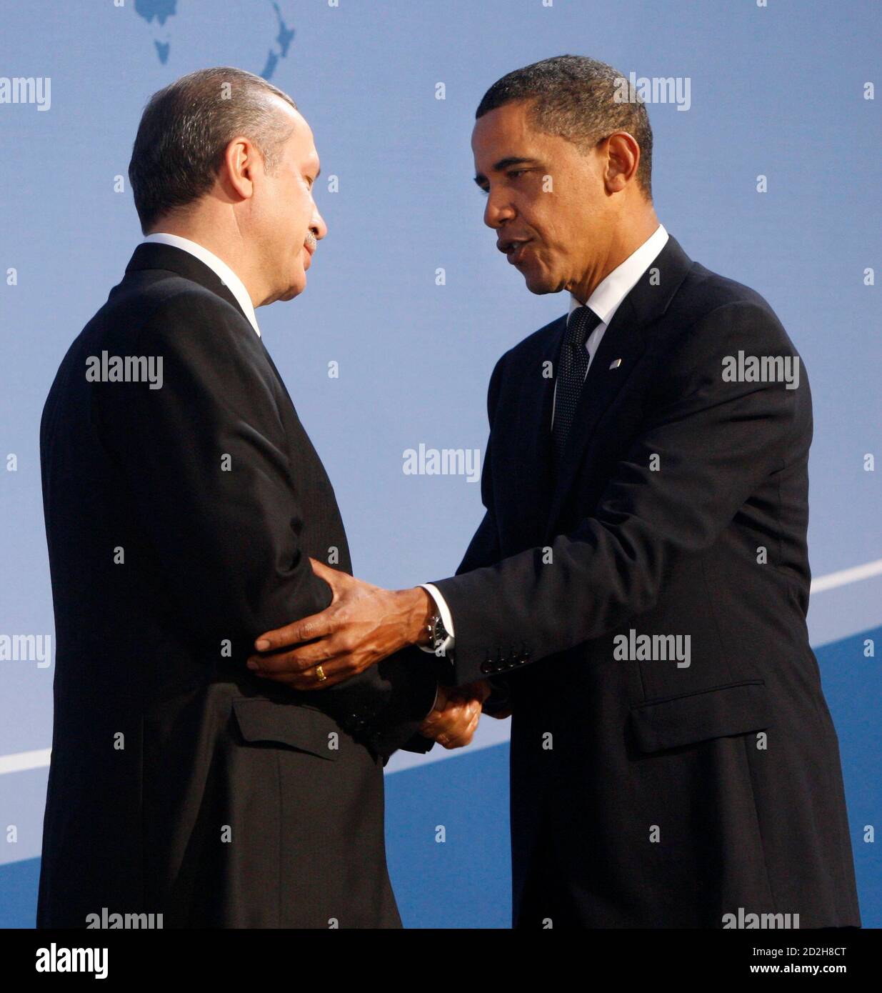Turkey's Prime Minister Tayyip Erdogan (L) is greeted by U.S. President Barack Obama as they arrive at the Phipps Conservatory for an opening reception and working dinner for heads of delegation at the Pittsburgh G20 Summit in Pittsburgh, Pennsylvania September 24, 2009.     REUTERS/Chris Wattie (UNITED STATES POLITICS) Stock Photo