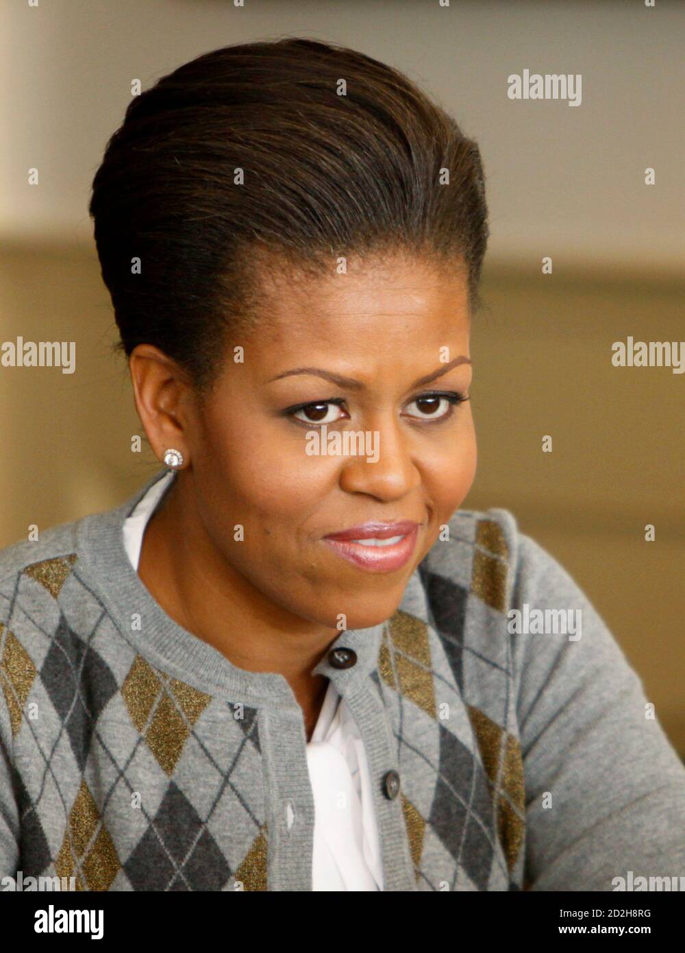 U.S. first lady Michelle Obama talks to others at her table at a Girls Mentoring Luncheon at the Governor's Mansion in Denver, Colorado November 16, 2009. REUTERS/Rick Wilking (UNITED STATES POLITICS EDUCATION HEADSHOT) Stock Photo